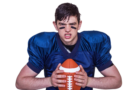 Portrait of an enraged american football player on a white backgroundの写真素材