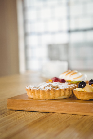 Pies on a wooden table in a cafeの写真素材