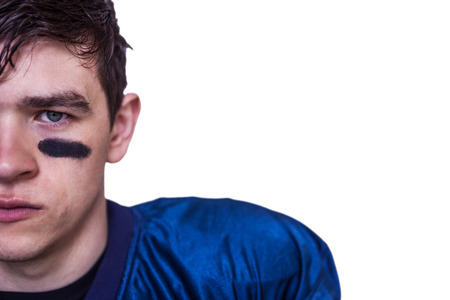 Portrait of a stern american football player on white backgroundの写真素材