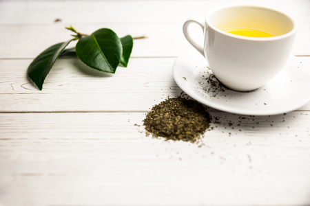 Cup of herbal tea on table shot in studioの写真素材