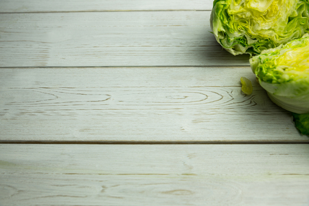 Lettuce halved on a table shot in studioの写真素材