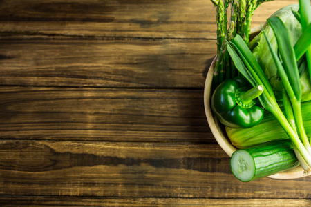Green vegetables in bowl shot in studioの写真素材