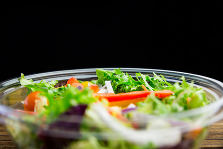 Healthy bowl of salad on table shot in studioの写真素材