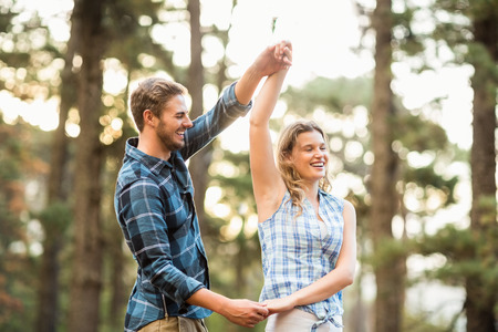 Happy smiling couple dancing in the natureの写真素材