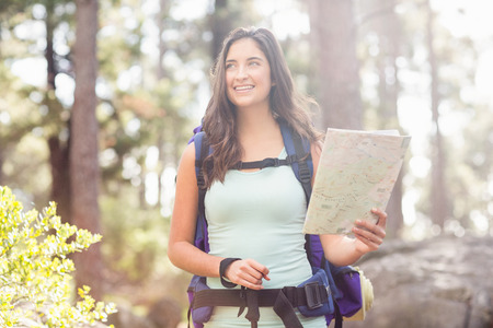 Young happy jogger looking in the distance in the natureの写真素材