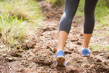 Close up view of athletes legs on trail in the natureの写真素材