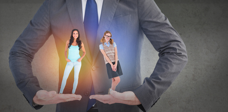 Geeky hipster woman smiling at camera  against grey roomの写真素材