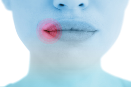 Woman with luscious lips against highlighted painの写真素材