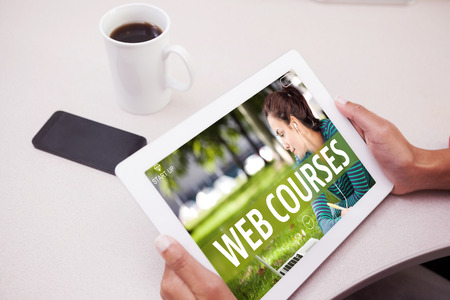 Woman using tablet pc  against web course adの写真素材