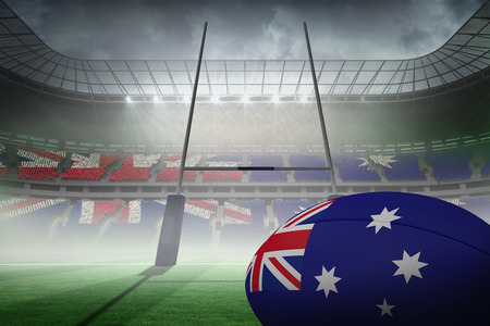 Australian flag rugby ball against rugby pitchの写真素材