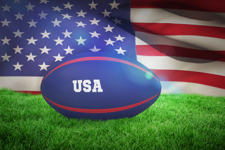 USA rugby ball against close-up of american flagの写真素材