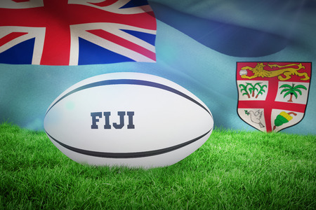 Fiji rugby ball against fiji flag over white backgroundの写真素材