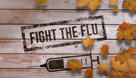 Autumn leaves against digitally generated grey wooden planksの写真素材