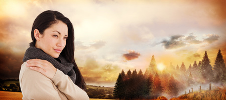 Gorgeous brunette looking away against country sceneの写真素材