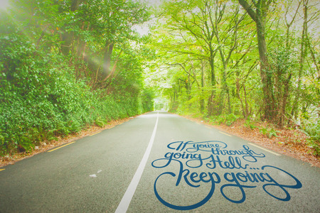 Motivational message against country roadの写真素材
