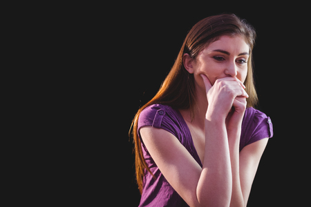 Unhappy woman thinking  on black backgroundの写真素材