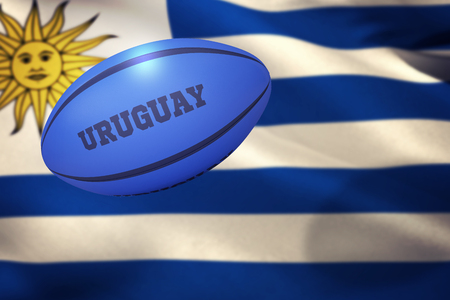 Uruguay rugby ball against close-up of uruguayan flagの写真素材