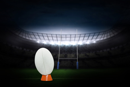 rugby ball against rugby stadiumの写真素材