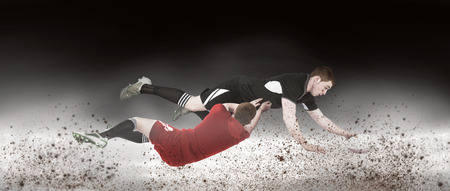 A rugby player scoring a try against spotlightの写真素材