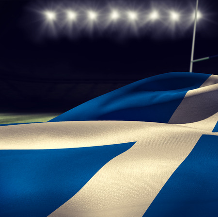Waving Scottish flag against rugby stadiumの写真素材