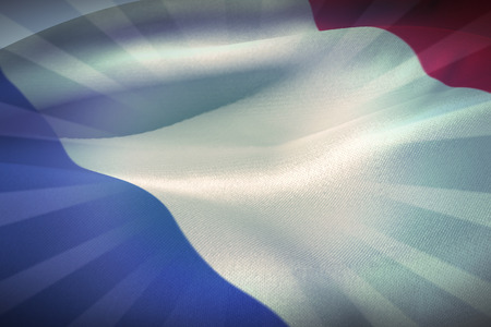Waving France flag against blue backgroundの写真素材