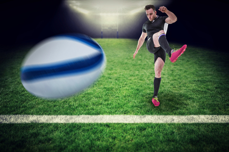 Rugby ball against blue backgroundの写真素材