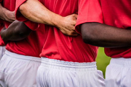 Rugby players standing together before match at the parkの写真素材