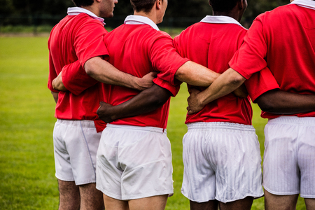 Rugby players standing together before match at the parkの写真素材
