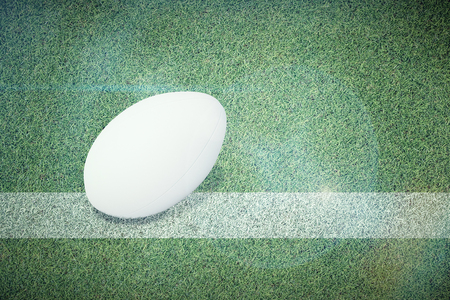 Rugby ball against pitch with lineの写真素材