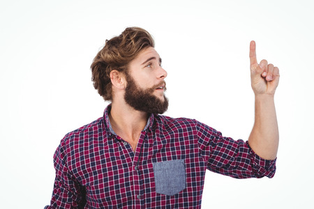 Hipster pointing upwards against white backgroundの写真素材