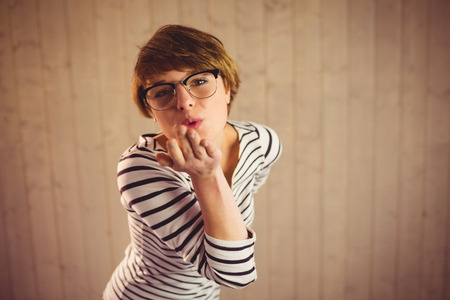 Portrait of pretty young woman blowing kissesの写真素材