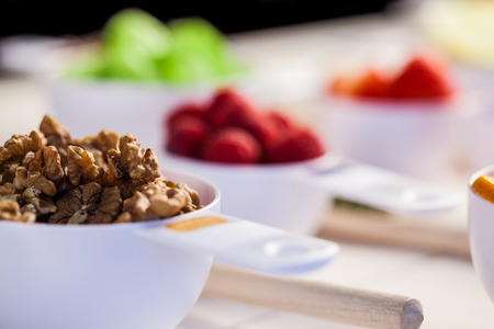 Portion cups of healthy ingredients on wooden tableの写真素材