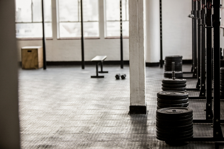 Barbell disc plates arranged in the gymの写真素材
