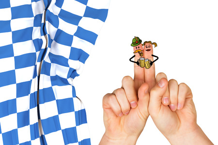 Oktoberfest character fingers against blue and white flagの写真素材