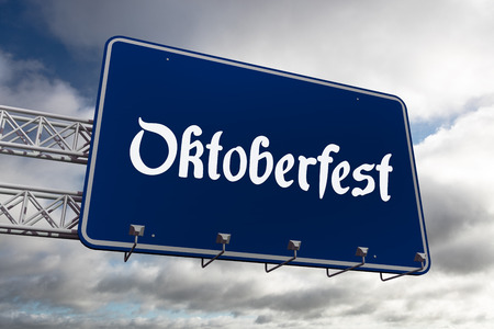 Oktoberfest graphics against blue sky with cloudsの写真素材