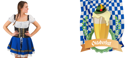 Pretty oktoberfest girl with hands on hips against oktoberfest graphicsの写真素材