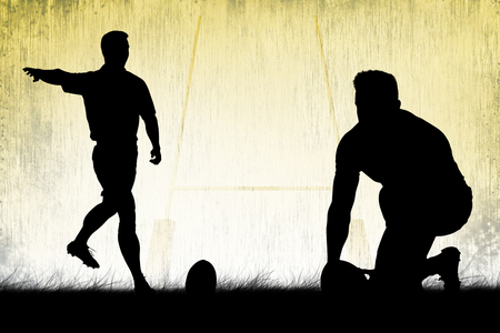 Silhouette of rugby player against rugby pitchの写真素材