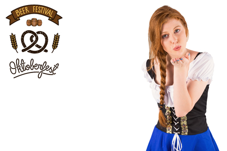 Oktoberfest girl blowing a kiss against oktoberfest graphicsの写真素材