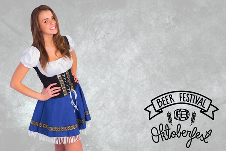 Oktoberfest girl smiling at camera against oktoberfest graphicsの写真素材