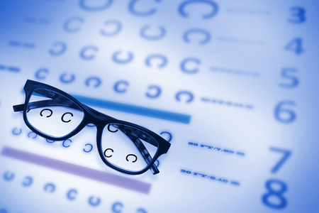 Reading glasses against eye testの写真素材