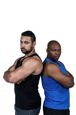 Strong friends looking at camera on white backgroundの写真素材