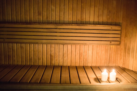Candles lighting in a sauna at the spaの写真素材