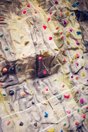 Rock climbing wall at the gymの写真素材