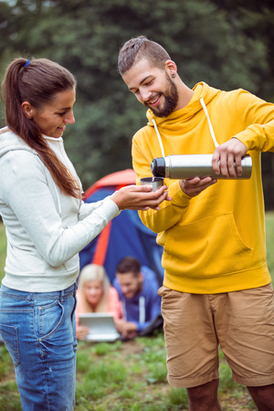 Happy friends on a camping trip in the countrysideの写真素材