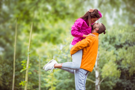 Happy couple hugging on hike in the countrysideの写真素材
