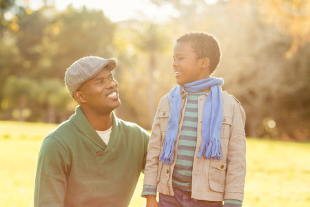 Portrait of a father with his son on an autumns dayの写真素材