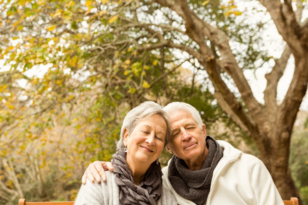 Senior couple in the park on an autumns day