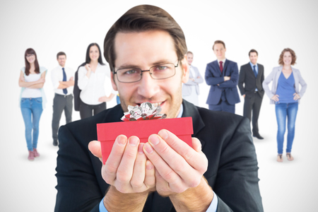 Businessman holding his hands out against presentの写真素材