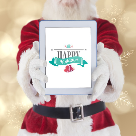 Santa presents a tablet PC against cream snow flake pattern designの写真素材