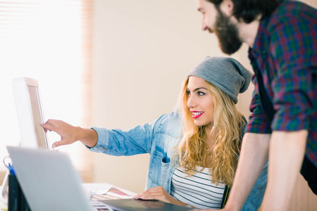 Creative team working at desk in casual office